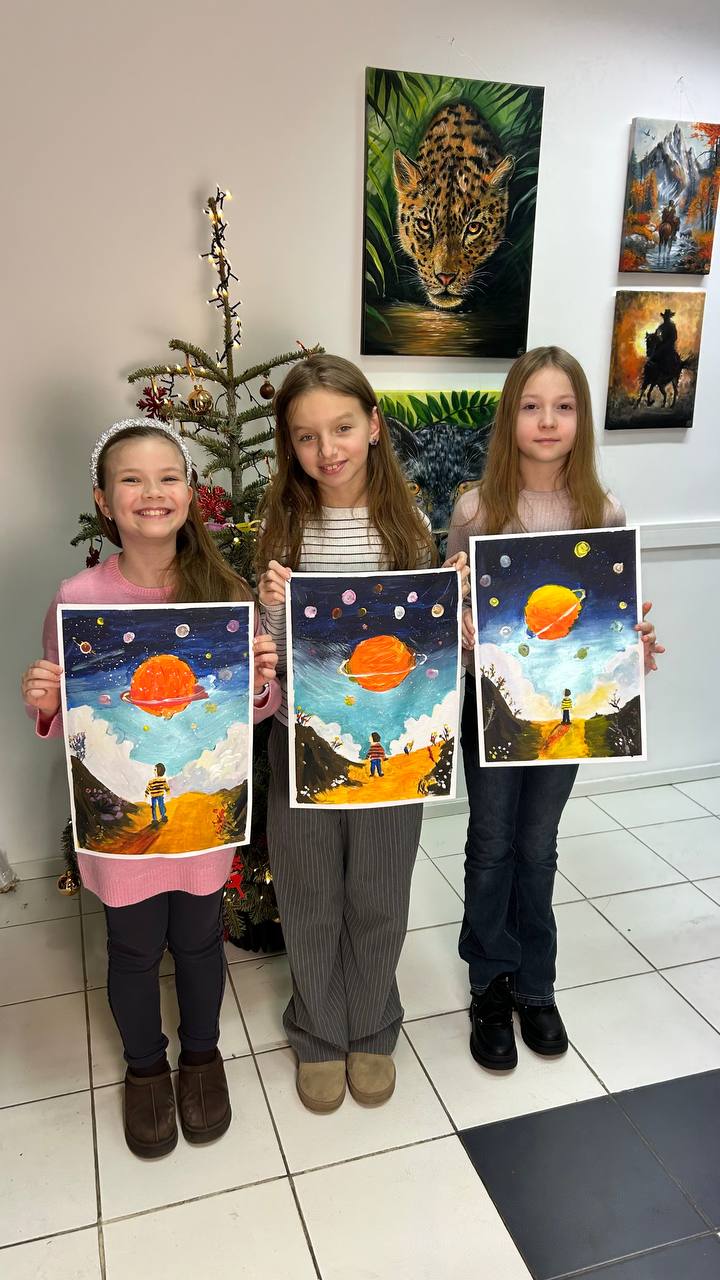 Three girls with their planet paintings